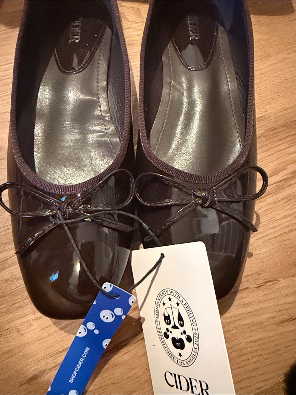 Cider Women's Dark Brown Patent Ballet Flats with Bow Accent